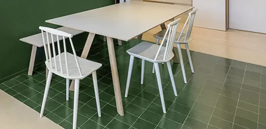 Dark green kitchen cement tile floor with furniture